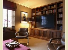 Media room in American Black Walnut, with matching radiator cover